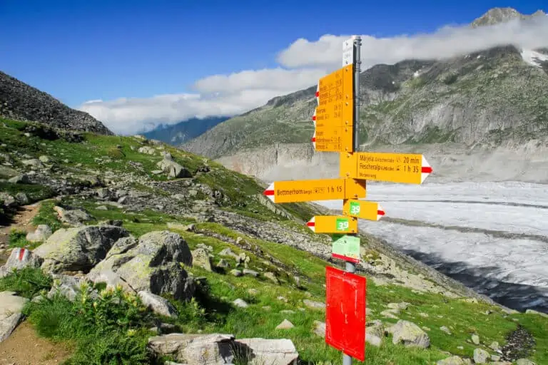 Yellow Swiss hiking signs along the Aletsch Glacier near Bettmerhorn