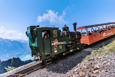 Brienzer Rothorn steam train locomotive high above Lake Brienz.
