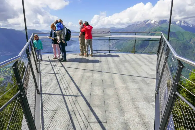 Tourists at suspended viewing platform at Cardada, Lake Maggiore