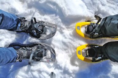 Feet in boots and snowshoes
