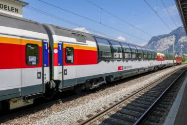 The Gotthard Panorama Express train with its high windows at the station of Flüelen.