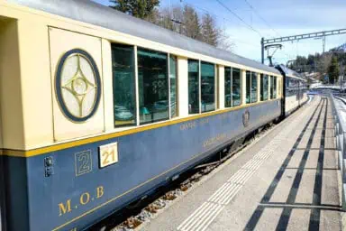 A GoldenPass Belle Époque train at the station of Saanenmöser.
