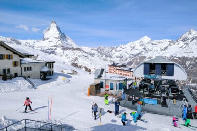 The mid-station Riffelberg with skies, gondolas and Matterhorn.