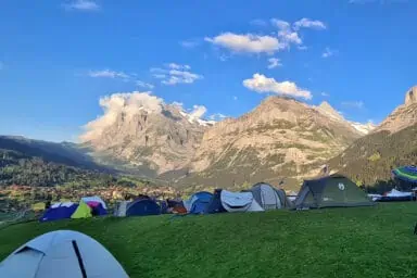 Campsite with tents and Wetterhorn view near Grindelwald