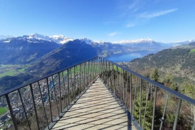 Panorama of the Bernese Alps, Lake Thun and the Niesen from the Two Lakes Bridge at Harder Kulm.
