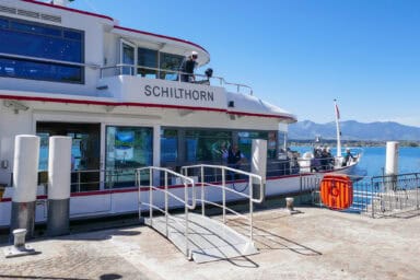 A boat docking at Hilterfingen on Lake Thun.