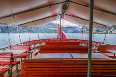 Roofed outdoor seats on a steamboat at Lake Lucerne.