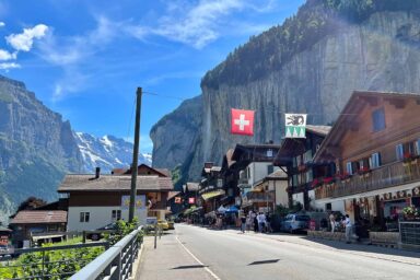 Lauterbrunnen village with flags and shops