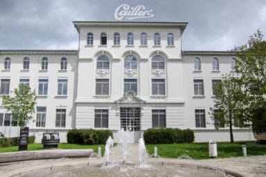 White facade of the Maison Cailler chocolate factory and museum.