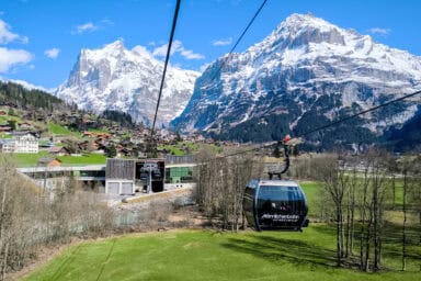 The Männlichen gondolas in early April: budding spring nature near Grindelwald down in the valley.