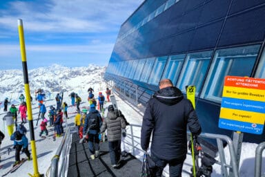 Skiers and restaurant exterior at Matterhorn Glacier Paradise.