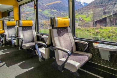 Storage space for luggage between the seats of an MGB train in the Matter Valley.