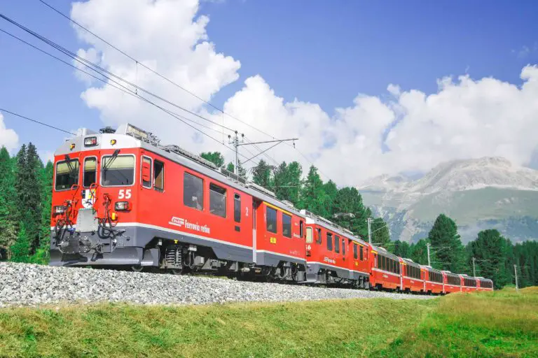 RhB train with panoramic coaches near Punt Muragl, Oberengadin
