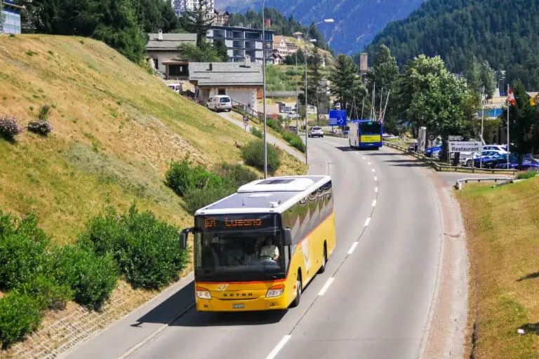Swiss postbus on road in St. Moritz