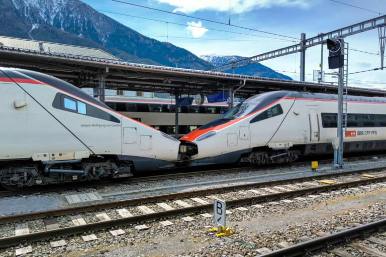 An EC (EuroCity) train at the railway station of Visp.