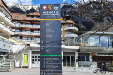 Directions to hotels and tourist facilities opposite the Wengen station.